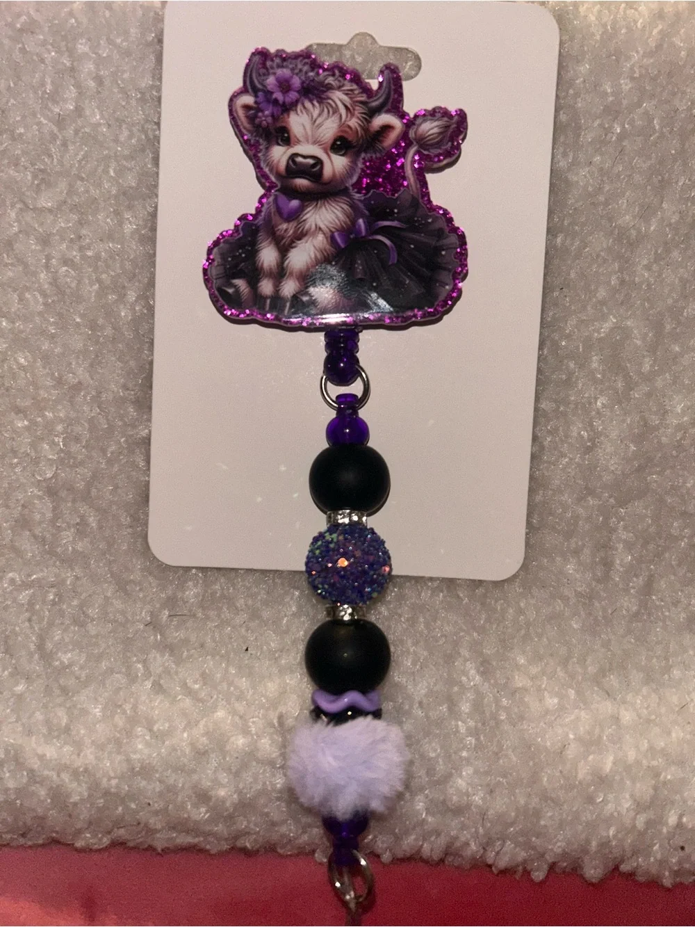 Highland cow Purple Glitter Pom-Bead badge reel